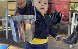 Baby showing off his bucket